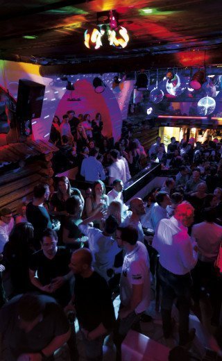 Party crowd on the dance floor at the "Pöstli Club" in Davos