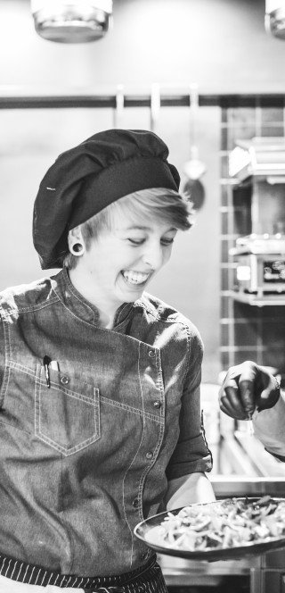 Historic picture of a female chef in 110 Years Posthotel