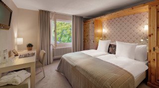 Doppelzimmer Sport Bett im Haus Poschavio