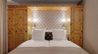 Doppelzimmer Sport im Haus Poschavio Bett