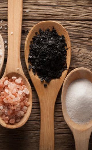 Curry spices in wooden spoons