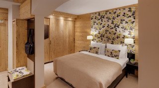 Schlafzimmer der Junior Suite im Schweizerhof Haupthaus 